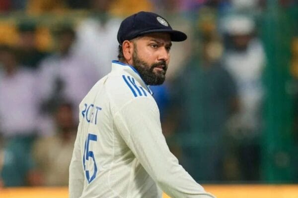 Indian cricket captain Rohit Sharma walking off the field during a Test match, in the Indian team jersey