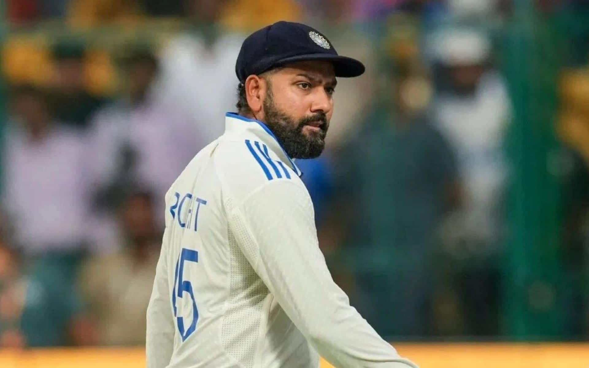 Indian cricket captain Rohit Sharma walking off the field during a Test match, in the Indian team jersey