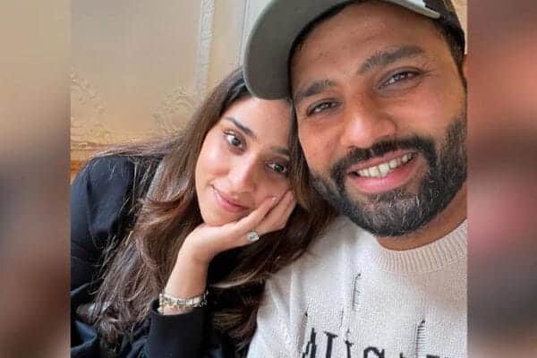 Indian cricket captain Rohit Sharma with his wife and daughter at a public event.