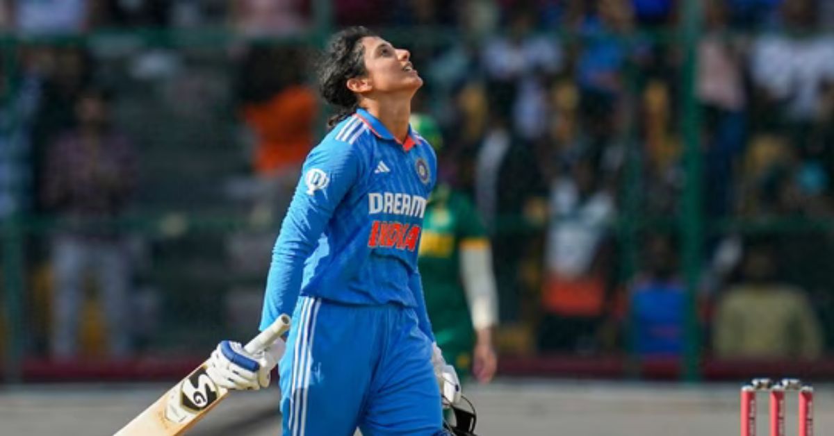 Smriti Mandhana walking back after being dismissed by Megan Schutt.