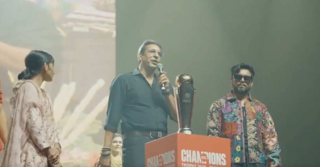 Wasim Akram holding the ICC Champions Trophy during the Coke Studio event in Pakistan.