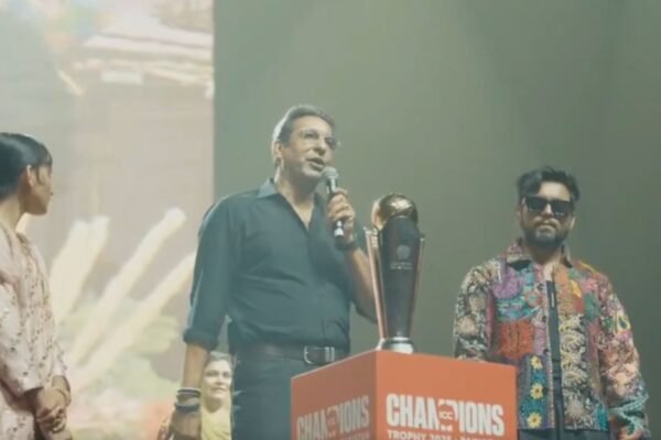 Wasim Akram holding the ICC Champions Trophy during the Coke Studio event in Pakistan.